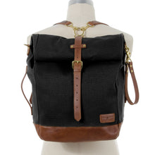 Load image into Gallery viewer, RollTote in black canvas with tan leather trim
